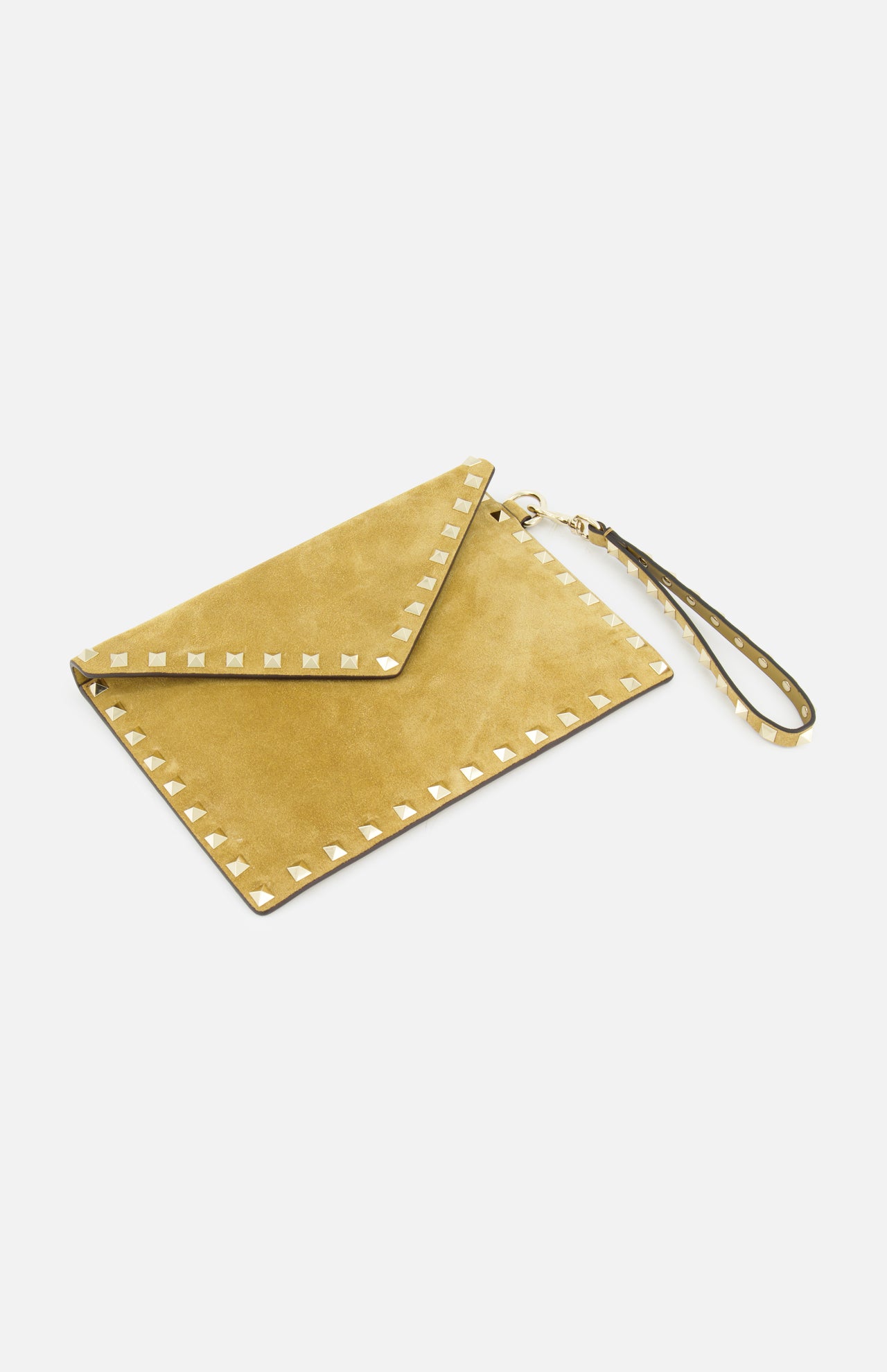 The VALENTINO GARAVANI Rockstud Suede Medium Flat Pouch, shown on a white background, features tan suede with gold rockstud trim, a coordinating wrist strap, and a flap closure.