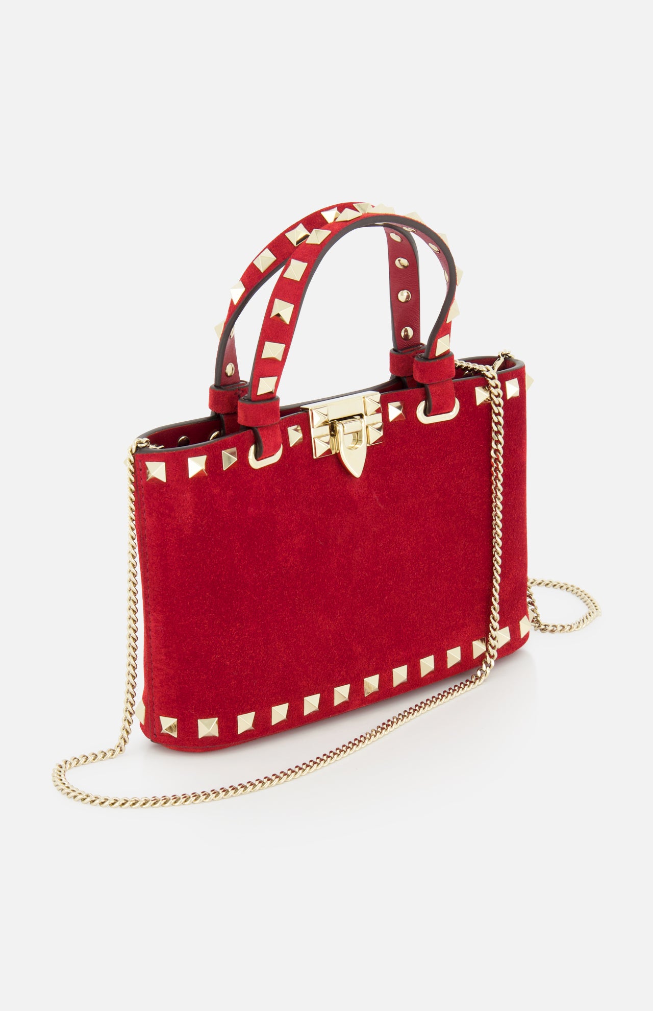 The VALENTINO GARAVANI Rockstud Suede Mini Bag features red suede, gold studded edges, a matching handle, gold clasp, and a detachable chain strap, shown against a white background.