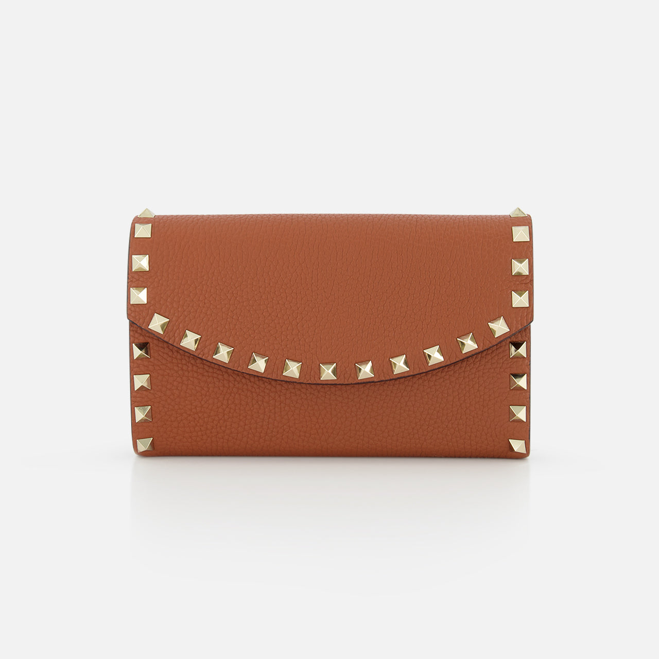 The VALENTINO GARAVANI Rockstud Wallet with Chain Strap is a brown leather mini bag with a wallet-inspired shape, flap closure, and gold rockstud trim along the edges, shown on a plain white background.