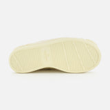 The image features the light-colored, textured rubber sole of the VALENTINO GARAVANI Royco Shearling Platform Sneaker, accented with subtle logo detailing and presented against a white background.