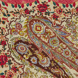 The Shawls Floral Foulard Scarf by VALENTINO GARAVANI features an intricate paisley and floral design in red, brown, blue, yellow, and green on cream, evoking classic elegance ideal for designer accessories or a silk scarf.