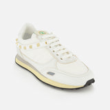 White Valentino Garavani Stud Up low-top sneakers featuring a row of rockstud trims around the heel and a two-tone midsole.