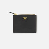 The VALENTINO GARAVANI V Logo Signature Coin Purse and Card Case is a black leather holder with a gold-tone logo on the front, card slots, and zip closure, shown against a plain white background.