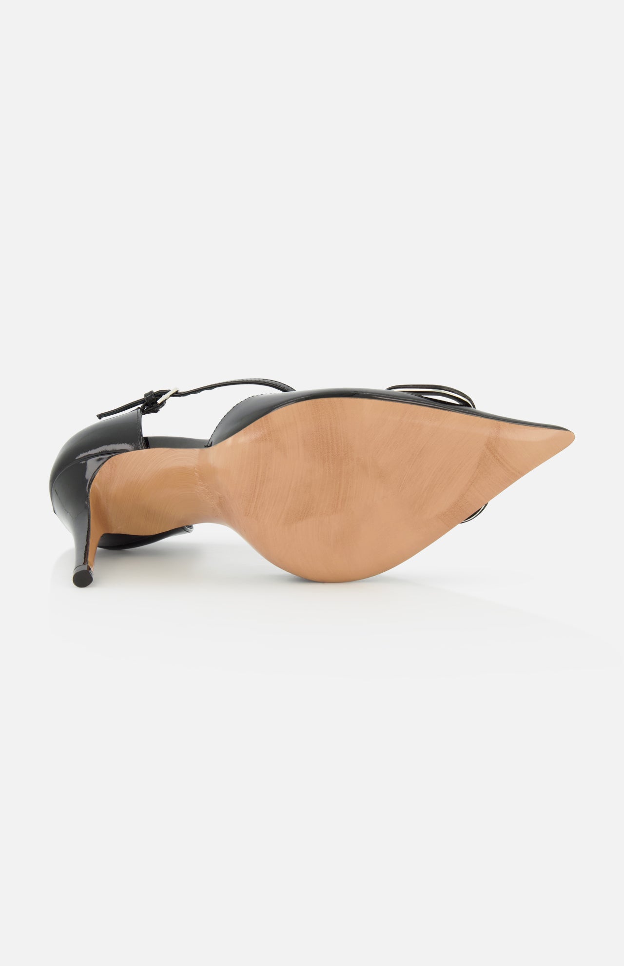 The VALENTINO GARAVANI V Logo Signature D'Orsay Heel is a black patent leather pump with a pointed toe, thin ankle strap, tan sole, and sleek stiletto heel, shown from the bottom for added detail.