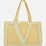 The Viva Superstar Crochet Large Tote Bag by VALENTINO GARAVANI is a woven beige bag with dual handles and a bold light V pattern—perfect as a stylish beach tote for sunny days.