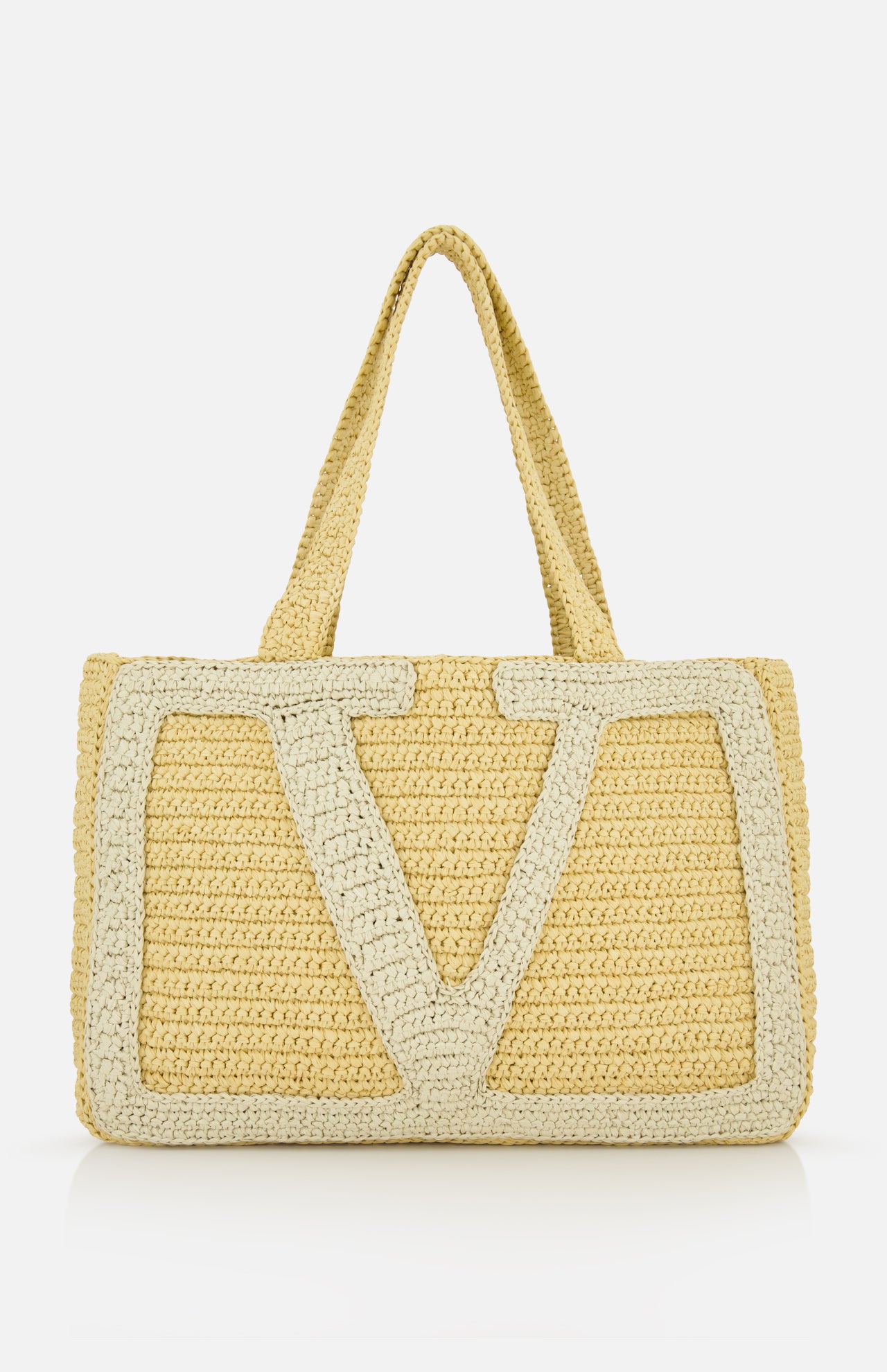 The Viva Superstar Crochet Large Tote Bag by VALENTINO GARAVANI is a woven beige bag with dual handles and a bold light V pattern—perfect as a stylish beach tote for sunny days.