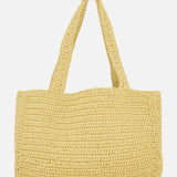 The VALENTINO GARAVANI Viva Superstar Crochet Medium Tote Bag features wide handles and a rectangular shape, shown against a white backdrop—a chic and practical choice for the beach.