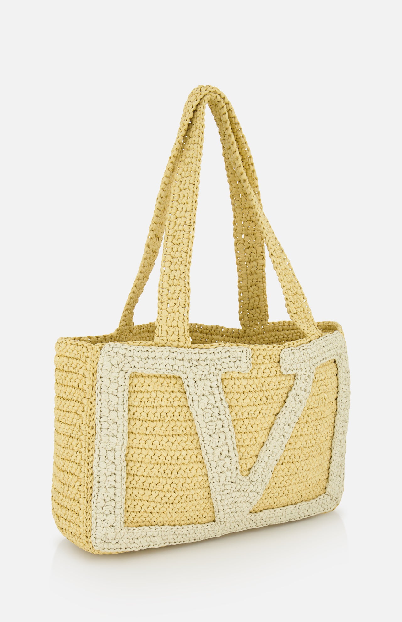 The Viva Superstar Crochet Medium Tote Bag by VALENTINO GARAVANI is a rectangular synthetic raffia beach bag with double handles and a large, textured light-colored V design on the front.