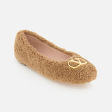 A single VALENTINO GARAVANI VLogo Signature Ballerina Flat in tan with a fuzzy teddy bear texture and a gold VLogo detail on the toe is displayed on a white background.