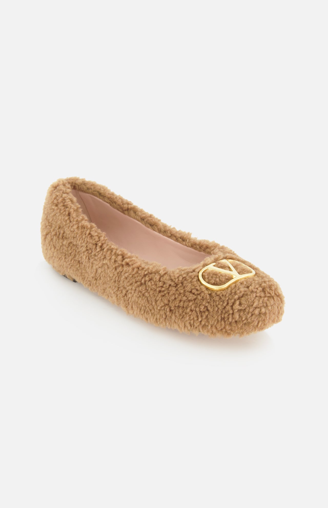 A single VALENTINO GARAVANI VLogo Signature Ballerina Flat in tan with a fuzzy teddy bear texture and a gold VLogo detail on the toe is displayed on a white background.