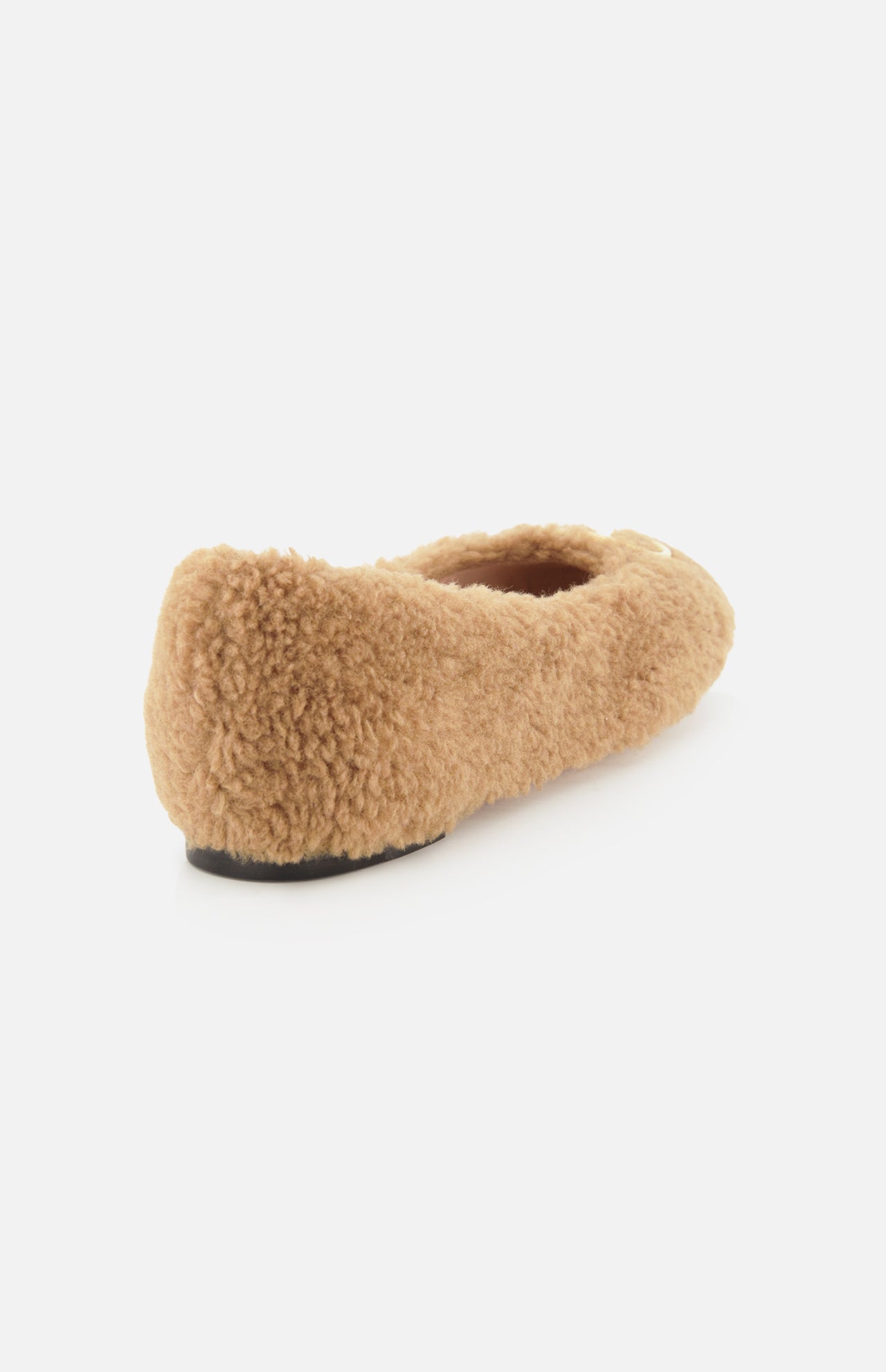 The VALENTINO GARAVANI VLogo Signature Ballerina Flat, a tan fuzzy teddy bear-style ballet flat with a black sole, is shown angled from the back on a white background.