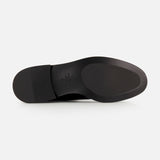 The image shows the bottom of the VALENTINO GARAVANI VLogo Signature Boot, featuring a smooth black leather sole and a slightly raised heel, photographed against a plain white background.