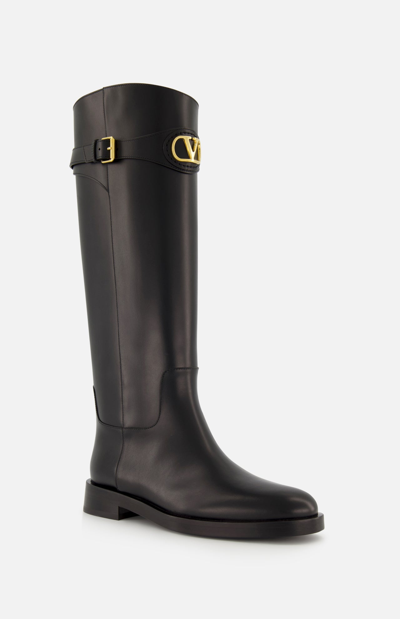 The VLogo Signature Boot by VALENTINO GARAVANI is a tall black leather equestrian boot featuring a low heel, gold buckle at the top, and a gold V logo detail on the outer side.