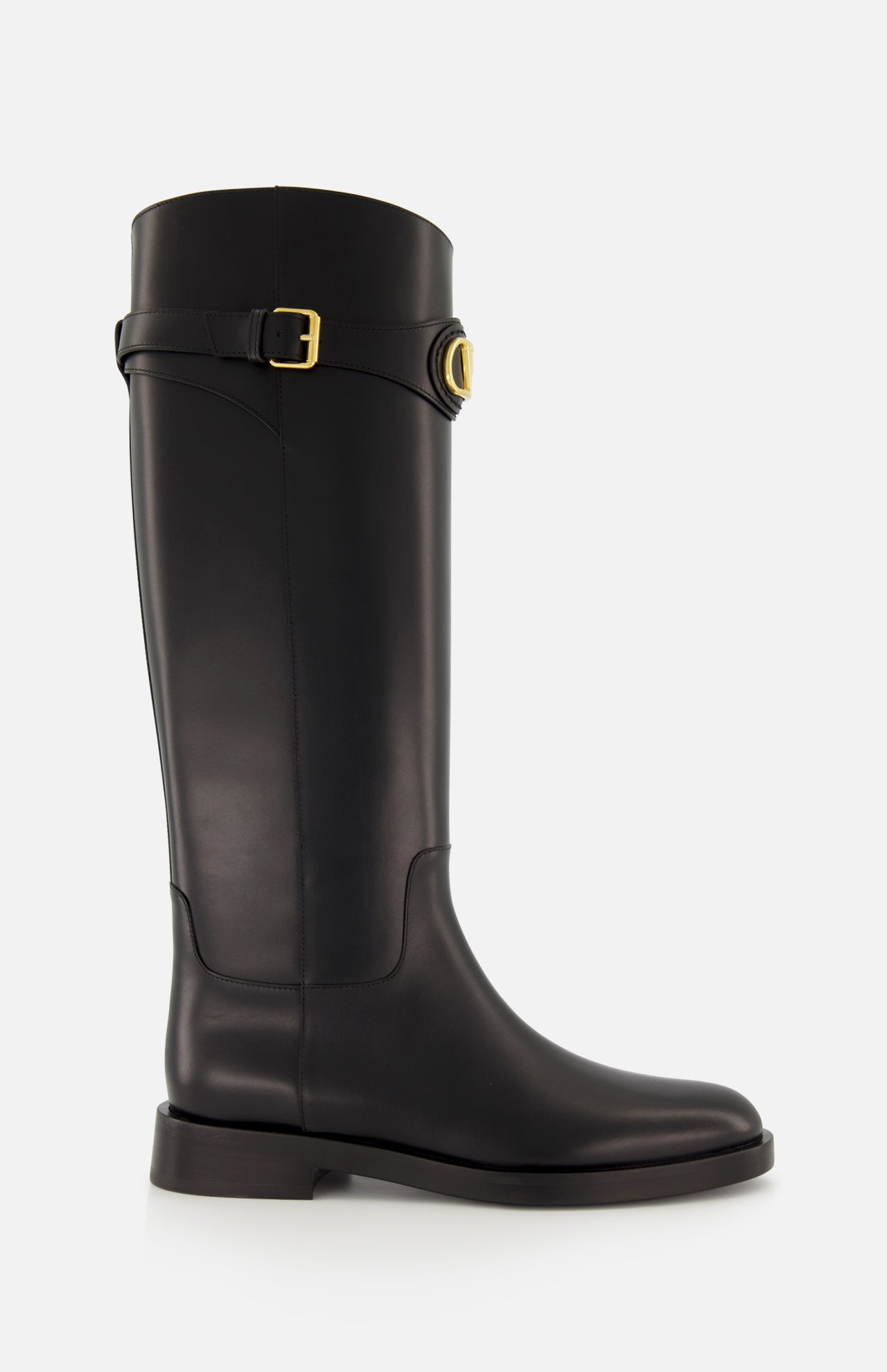 The VALENTINO GARAVANI VLogo Signature Boot is a black knee-high leather riding boot with a low heel, rounded toe, and gold-tone buckle detail at the top, shown against a plain white background.