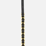 The VALENTINO GARAVANI VLogo Signature Chain Belt H. 12 is displayed vertically against a white background, crafted in black leather with elegant gold-tone hardware and distinctive gold-tone chain links at the center.