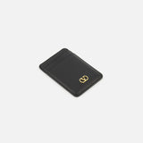 Valentino Garavani VLogo Signature Magnetic Card Holder in black leather with a gold V-shaped logo emblem on the front.