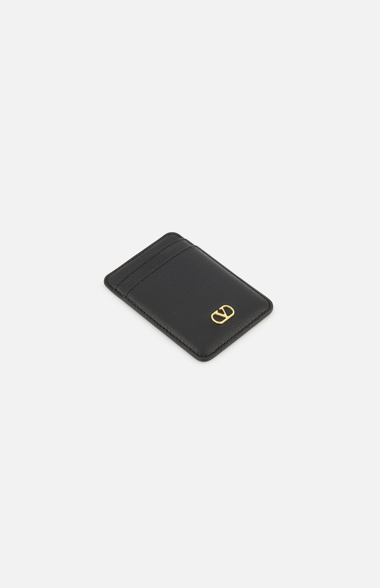 Valentino Garavani VLogo Signature Magnetic Card Holder in black leather with a gold V-shaped logo emblem on the front.