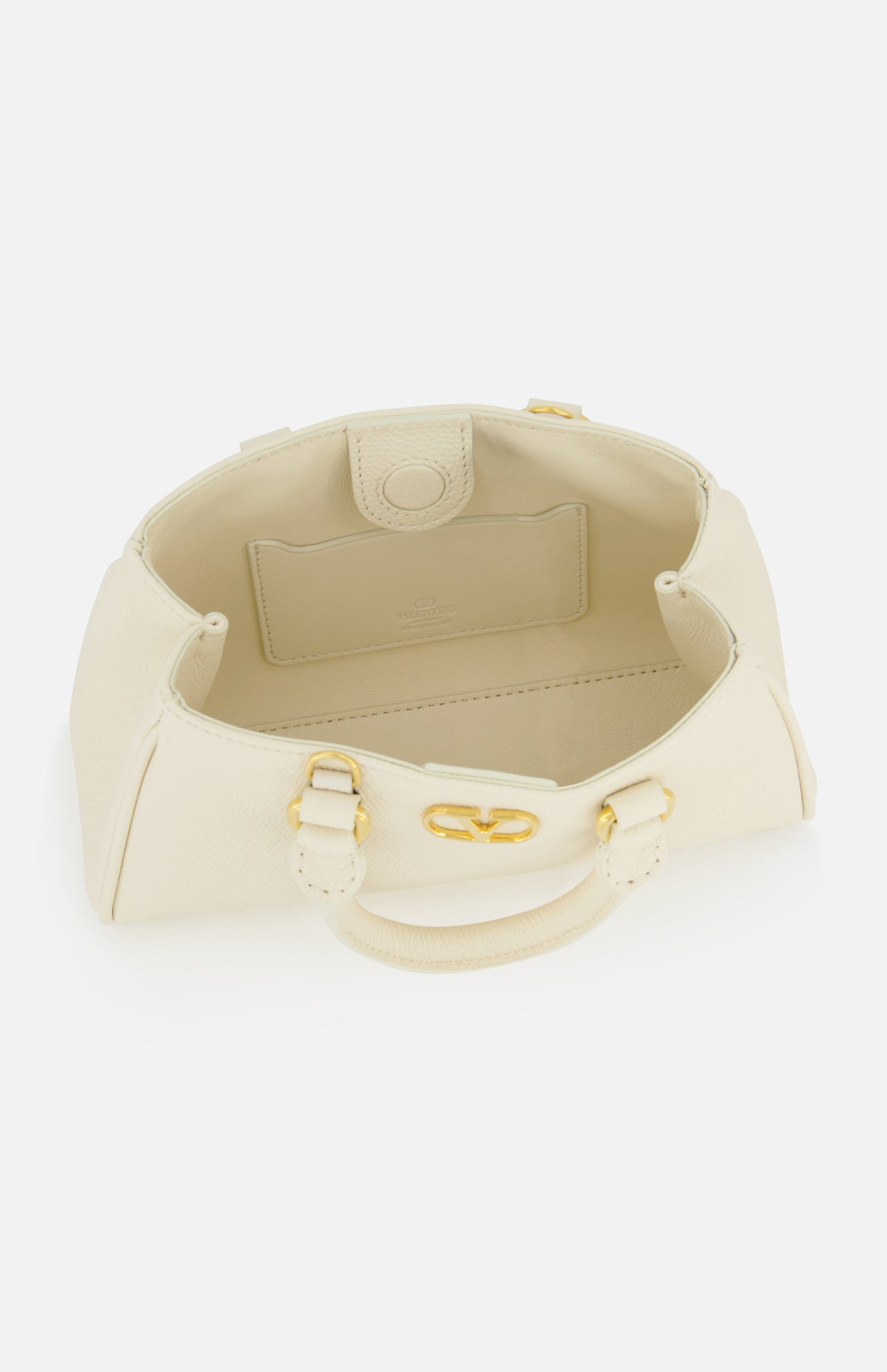 The VALENTINO GARAVANI VLogo Signature Mini Bag is an ivory bowling bag with gold hardware, an open top view revealing a roomy interior, a small inner pocket, and two handles.