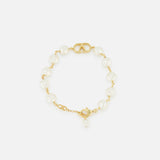 VALENTINO GARAVANI VLogo Signature Pearl Bracelet featuring a gold-tone logo accent at the center, with glass beads and a gold clasp. Photographed on a plain white background.