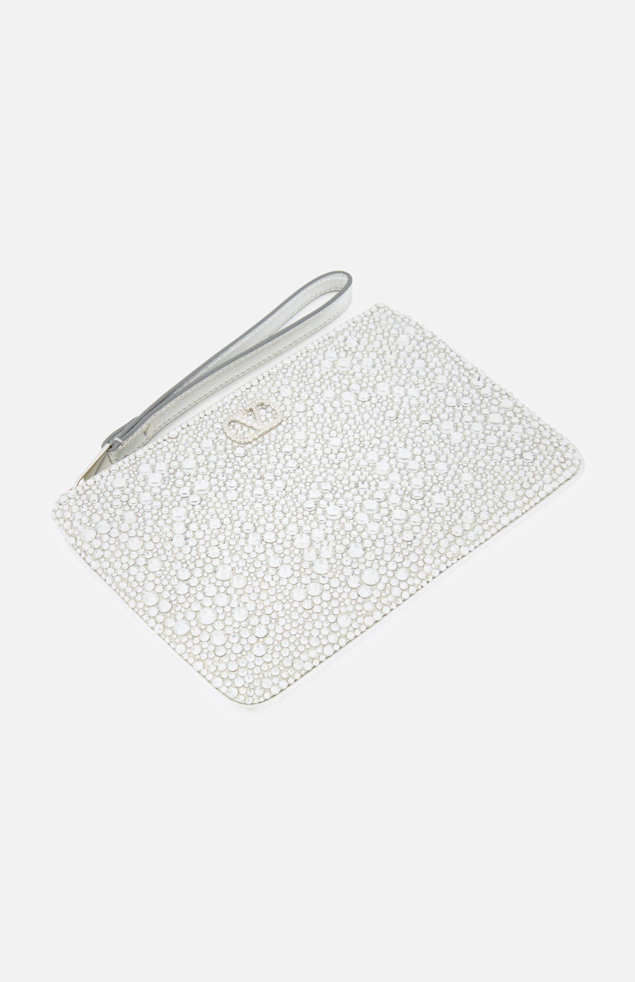 A dazzling silver VLogo Signature Small Flat Pouch by VALENTINO GARAVANI, adorned with shimmering Swarovski crystals and featuring a sleek silver strap and a subtle metallic logo at the top center. This elegant clutch is the perfect accessory for special occasions, beautifully displayed on a plain white background.