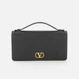 A black VALENTINO GARAVANI VLogo Signature Wallet with Strap featuring the iconic gold VLogo signature on the front, shown against a plain white background.