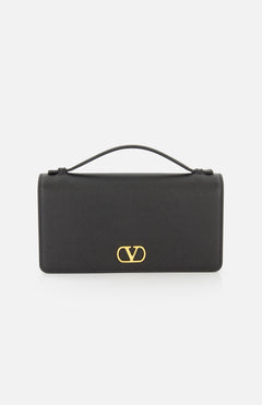 A black VALENTINO GARAVANI VLogo Signature Wallet with Strap featuring the iconic gold VLogo signature on the front, shown against a plain white background.
