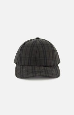 A front view of the Legacy Structured Oilskin Highland Hat by VARSITY HEADWEAR, showcasing its black and gray tartan design, curved brim, and adjustable back strap, displayed against a plain white background.