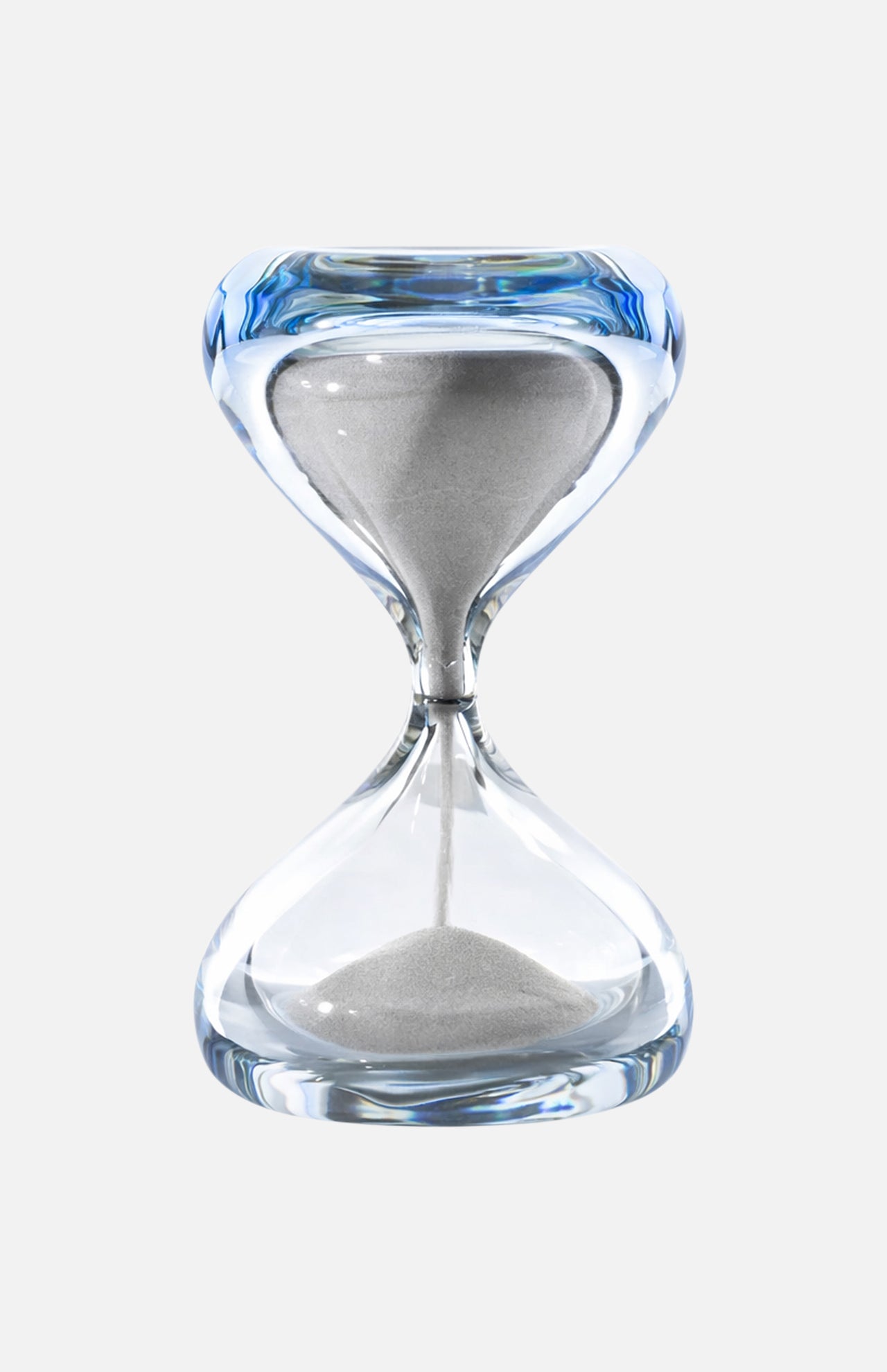 The VENINI Clessidra Sommersa Hour Glass features clear Murano glass with white sand flowing between chambers, shown against a plain white background.