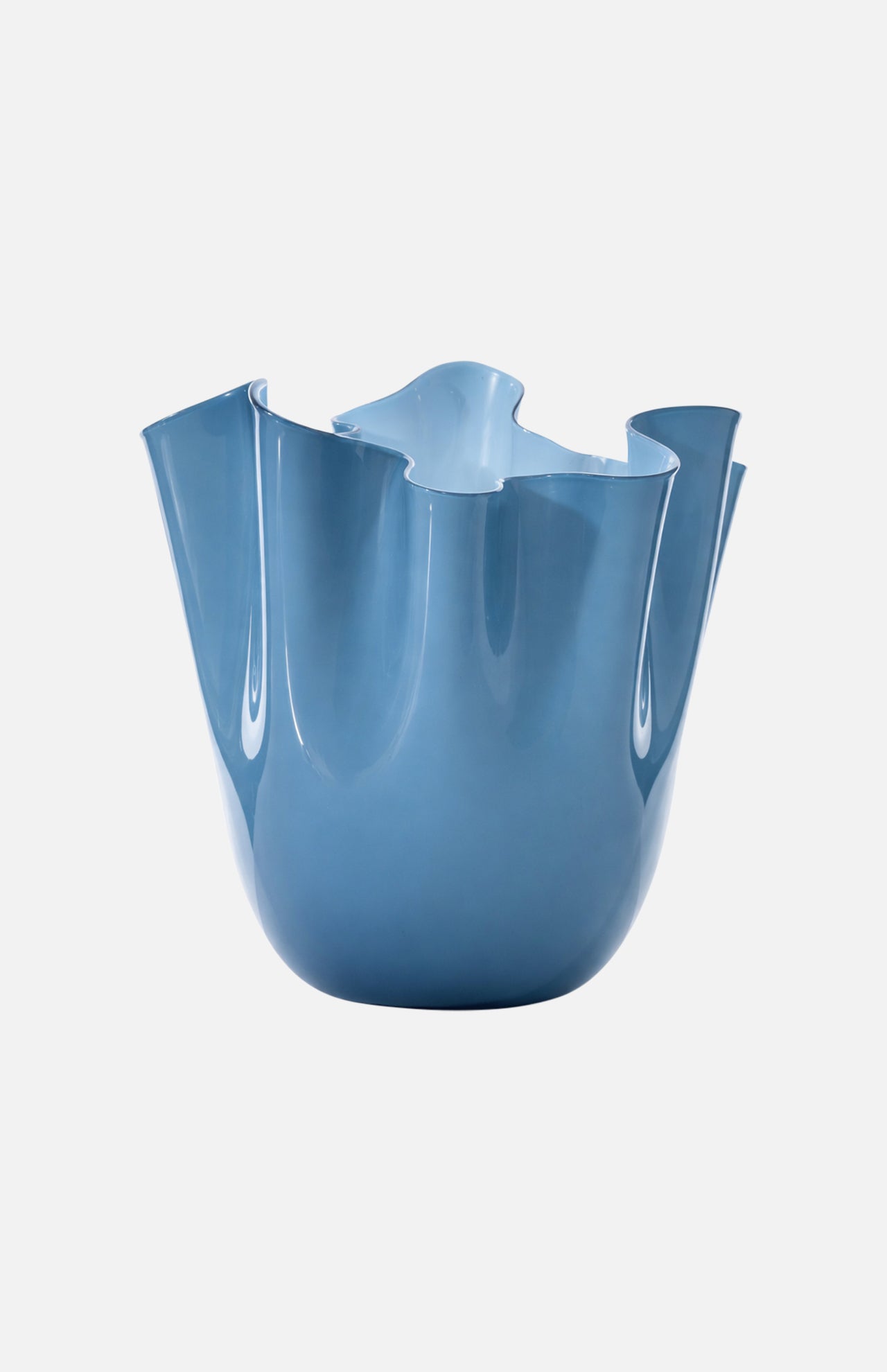 The VENINI Fazzoletto Opalino Vase is a modern sky blue Murano glass piece with an uneven, flower-like wavy rim, shown on a plain white background.