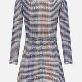 The Lauper Tweed-like Mini Dress by VERONICA BEARD is a long-sleeved, above-the-knee mini dress featuring a purple, gray, white, and rust orange plaid pattern, shown from the back on a plain white background.