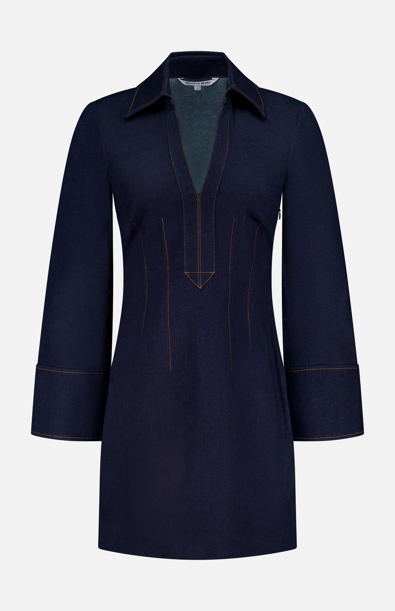 The Raymond Denim Mini Dress by VERONICA BEARD features dark blue denim, a wide collar, deep V-neckline, long sleeves with wide cuffs, tan stitching, and a tailored fit-and-flare silhouette for a timeless style.