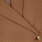 Close-up of the VERONICA BEARD Rupert Oversized Dickey Jacket in brown with light pinstripes, featuring the lapel, part of the collar, and two tan buttons; this blazer is dickey compatible for versatile styling.