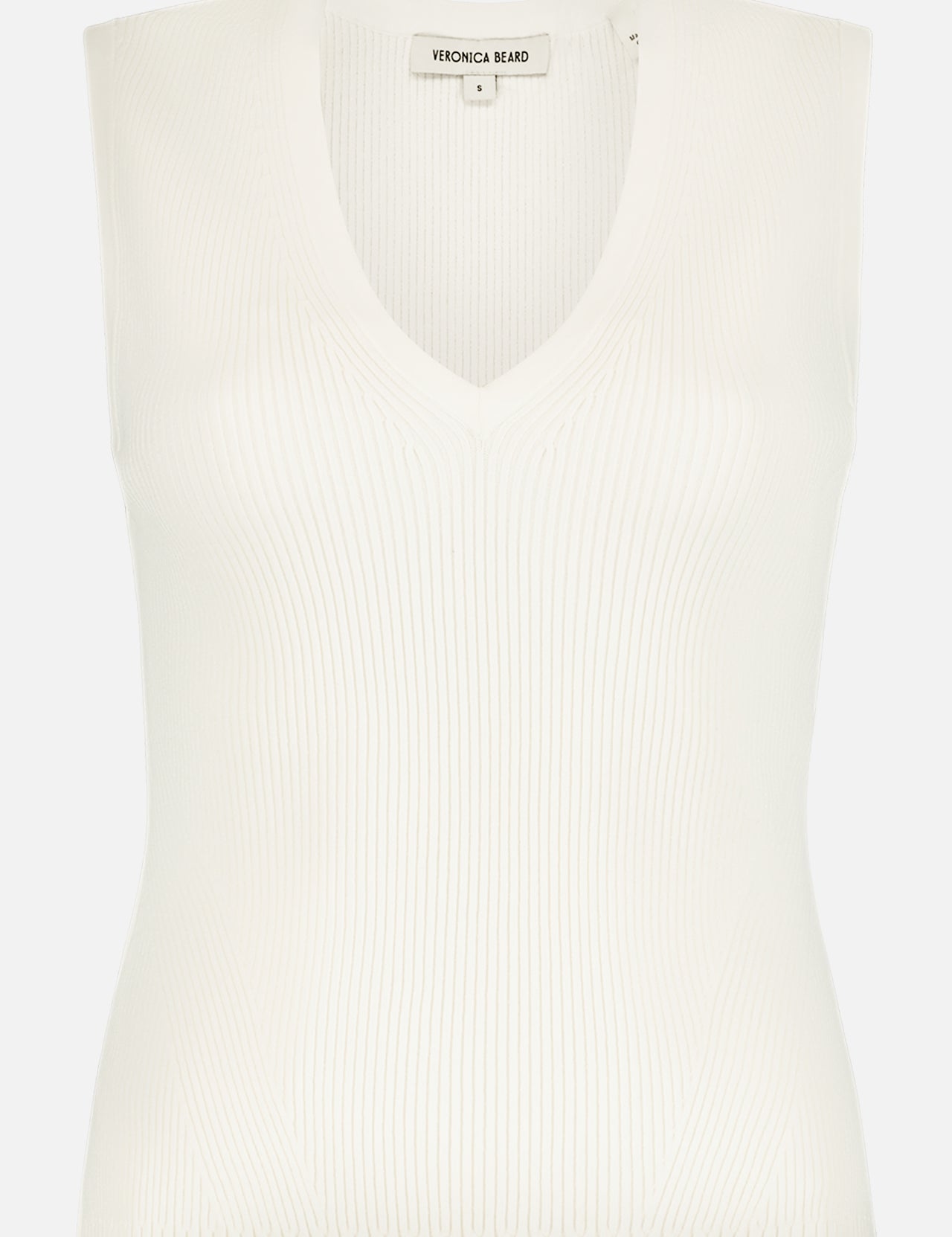 The Sid Sleeveless Pullover by VERONICA BEARD is a stretch-knit, ribbed V-neck top with a fitted silhouette. Shown on a plain white background, the label inside the neckline reads VERONICA BEARD.