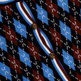 A close-up of the VERONICA BEARD Sylvane Cropped Argyle Cardigan, showcasing a slim fit, blue, black, and burgundy diamond pattern, gold round buttons, and a white, burgundy, and navy striped trim with the label near the collar.