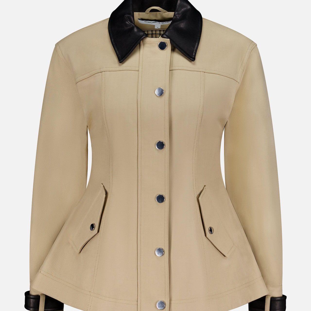 The Talla Water Repellant Jacket by VERONICA BEARD features a beige tailored fit, black leather collar and cuffs, button-down front, and angled flap pockets, shown against a plain white background.