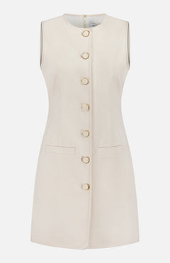 The VERONICA BEARD Whistler Stretch Cotton Mini Dress is a sleeveless, cream mini dress with a round neckline, gold front button closure, and two front welt pockets. Shown on a white background, it's perfect for effortless minimalist style.