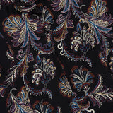 The Adrienne Paisley Mini Dress by VERONICA BEARD showcases a colorful paisley floral pattern in blue, gold, white, and burgundy on a sleek black background. Intricate swirling designs lend this dress an elegant, richly detailed look—making it the perfect choice for those seeking timeless sophistication in a standout bohemian style.