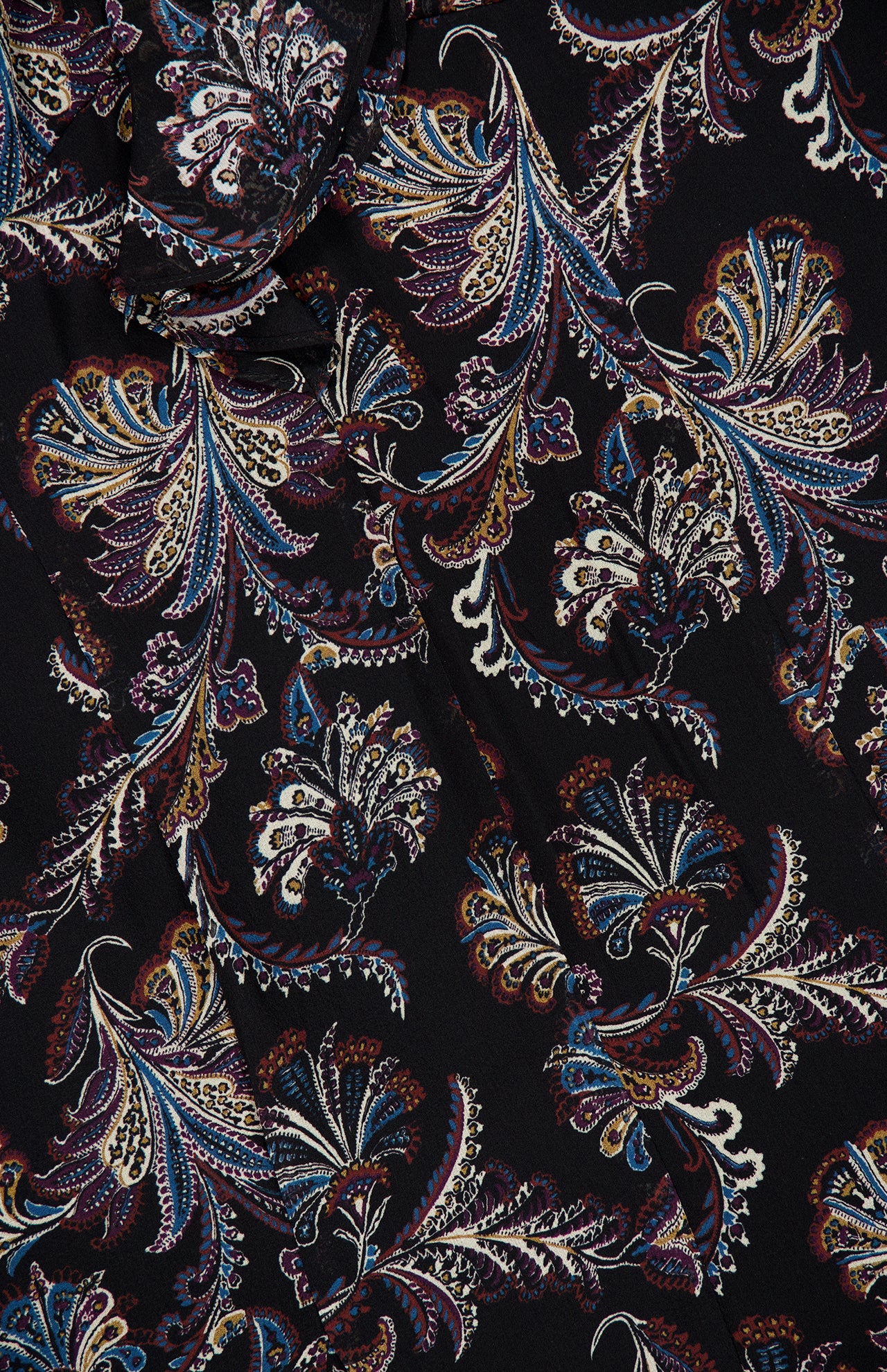 The Adrienne Paisley Mini Dress by VERONICA BEARD showcases a colorful paisley floral pattern in blue, gold, white, and burgundy on a sleek black background. Intricate swirling designs lend this dress an elegant, richly detailed look—making it the perfect choice for those seeking timeless sophistication in a standout bohemian style.