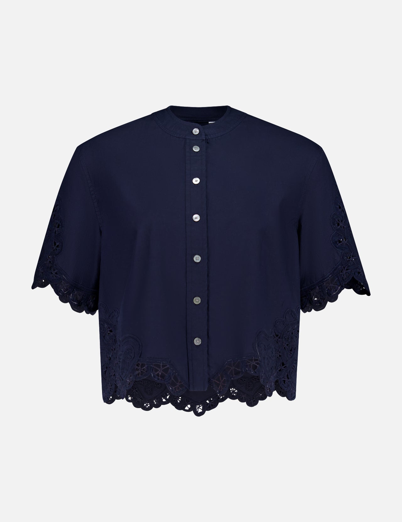 The Aleck Scalloped Embroidery Shirt by VERONICA BEARD is a navy, cotton poplin blouse with short sleeves, a button-down front, scalloped lace embroidery at the hem and sleeves, and decorative cut-out details. Displayed on a white background.