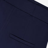 Close-up of VERONICA BEARD's Allman Wide Leg Button Tab Pant in navy, highlighting the single back welt pocket and detailed waistband against a plain white background.