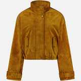 The Bateman Cropped Suede Jacket by VERONICA BEARD is a mustard yellow suede piece with a high funnel neck collar, snap buttons, flap pockets, and cuffed long sleeves—an ideal choice for stylish fall outerwear—shown against a plain white background.