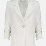 The Battista Dickey Jacket by VERONICA BEARD is a white blazer with stretch tailoring, notched lapels, long sleeves, a single button closure, and two front flap pockets, shown against a plain white background.