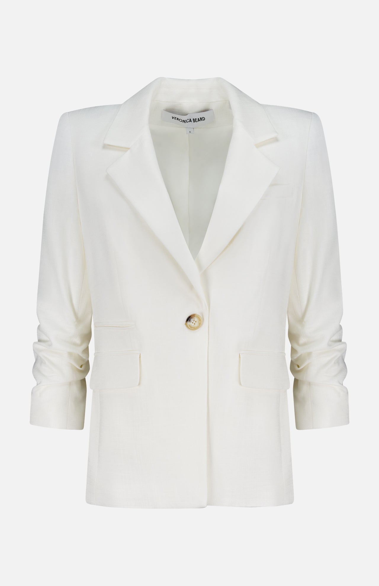 The Battista Dickey Jacket by VERONICA BEARD is a white blazer with stretch tailoring, notched lapels, long sleeves, a single button closure, and two front flap pockets, shown against a plain white background.