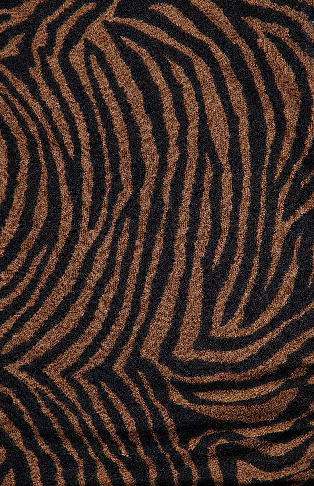 Close-up of the Veronica Beard Briana Ziger Print Top, a sleeveless mock neck knit fabric featuring a black and brown zebra print.