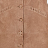 The Callisian Leather Midi Skirt by VERONICA BEARD is a luxurious brown lambskin suede A-line skirt, featuring a front button closure with gold ring details and two slanted front pockets for added style and convenience.