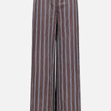 The Carraway Pant by VERONICA BEARD features a brown wide-leg design with vertical blue and white stripes, a high waistband, front button closure, and textured fabric, shown against a plain white background.