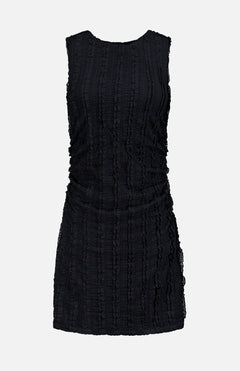 The Charissa Ruched Mini Dress by VERONICA BEARD is a sleeveless black textured mini dress featuring a round neckline, ruched sides, and a fitted silhouette, displayed against a plain light gray background.