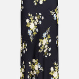 The Clover Floral Midi Skirt by VERONICA BEARD is a black slip skirt crafted from stretch georgette, featuring an elegant midi length and adorned with a vibrant pattern of white, yellow, and blue flowers with green leaves scattered across the fabric. This stylish skirt effortlessly blends comfort and sophistication for any occasion.