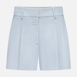 The Craig High Rise Short by VERONICA BEARD features light blue Italian cotton-blend twill, high waist, belt loops, front zipper, and crisp pleats—classic A-line shorts shown against a plain white background.