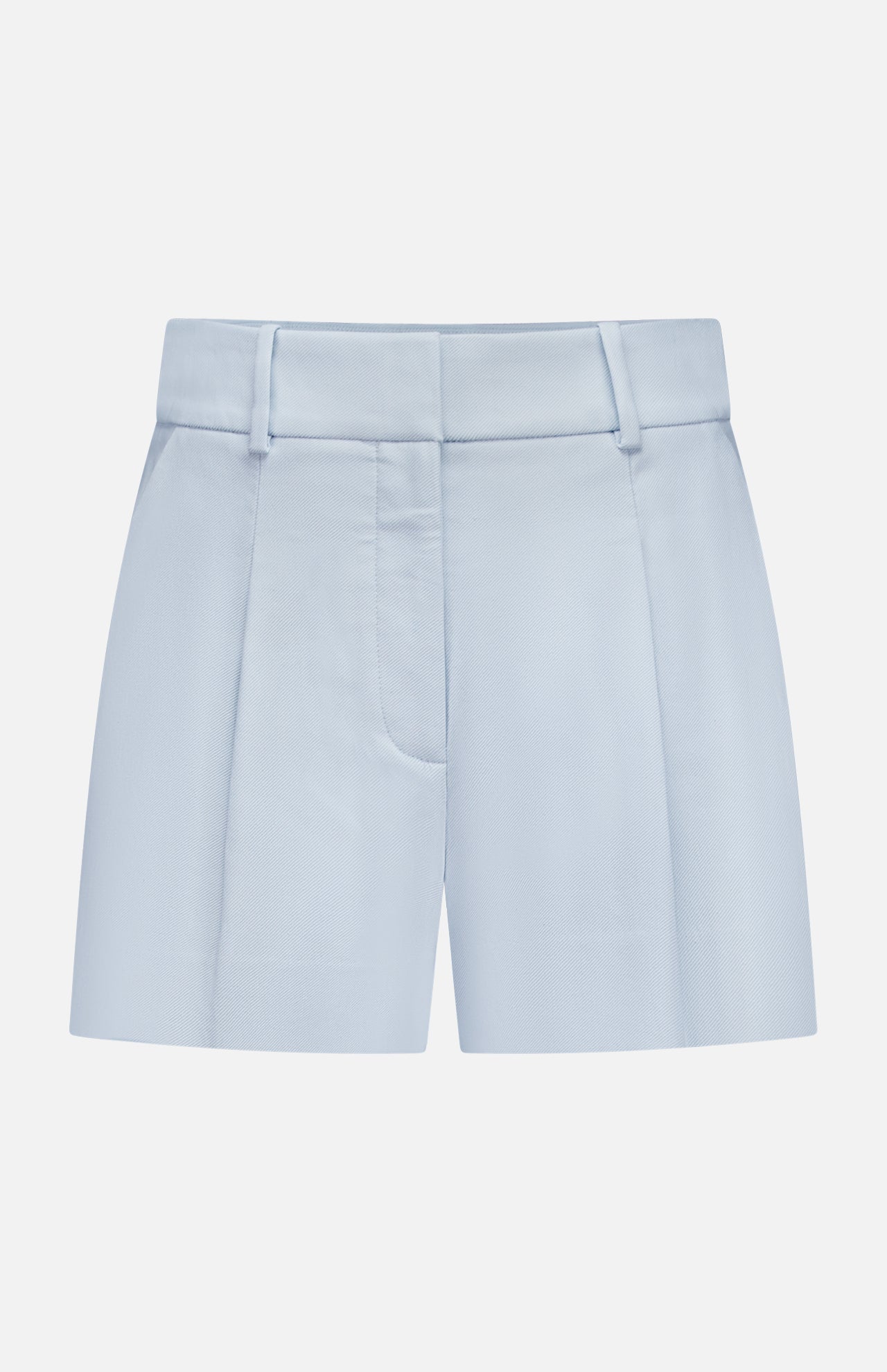 The Craig High Rise Short by VERONICA BEARD features light blue Italian cotton-blend twill, high waist, belt loops, front zipper, and crisp pleats—classic A-line shorts shown against a plain white background.